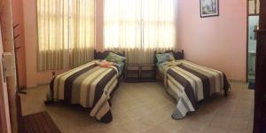 Un pat sau paturi într-o cameră la La Isla de los Tucanes