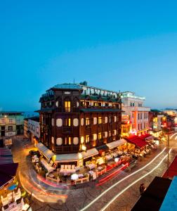 a large building on a city street at night at GLK PREMIER Acropol Suites & Spa in Istanbul