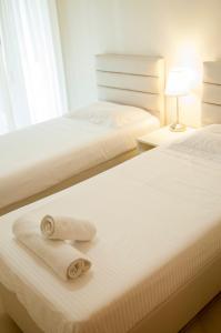 מיטה או מיטות בחדר ב-Cozy Bright Apartment