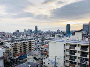 a view of a city skyline with buildings at Sea View Court Kobe in Kobe