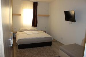 
A bed or beds in a room at Bed & Breakfast Vertigo Belgrade
