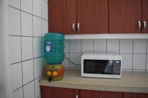 Kuchyň nebo kuchyňský kout v ubytování Alojamiento Castelnouvo, Entre Ríos, Guayaquil, Ecuador