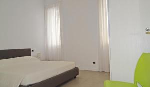 Posteľ alebo postele v izbe v ubytovaní Campione Ora apartments by Gardadomusmea