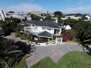 an aerial view of a large white house at Hallack Manor in Port Elizabeth