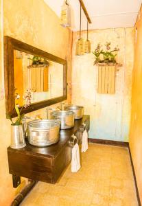 a kitchen with a counter with pots and pans at The Purpose Hostel in Antigua Guatemala