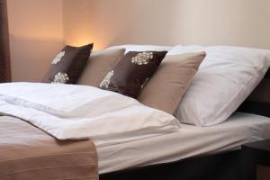 Posteľ alebo postele v izbe v ubytovaní Glam House Apartments