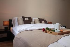 Posteľ alebo postele v izbe v ubytovaní Glam House Apartments