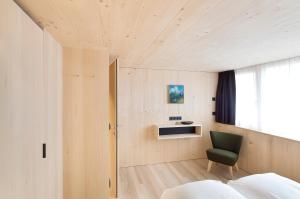 A bed or beds in a room at Försterhaus Mellau
