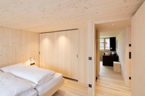 A bed or beds in a room at Försterhaus Mellau