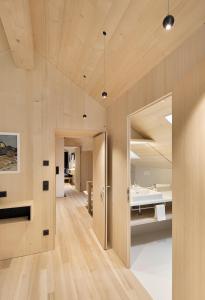 A bed or beds in a room at Försterhaus Mellau