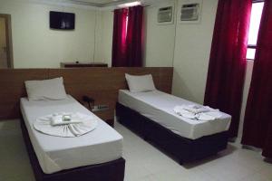 Cama o camas de una habitación en Rouge Hotel