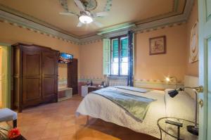
Ein Bett oder Betten in einem Zimmer der Unterkunft Villa Sant’Andrea
