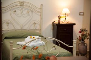 Posteľ alebo postele v izbe v ubytovaní Le Giare B&B