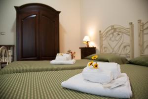 Posteľ alebo postele v izbe v ubytovaní Le Giare B&B