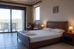 Postel nebo postele na pokoji v ubytování Calypso Apartments