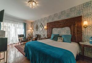 Postel nebo postele na pokoji v ubytování Rey Don Pedro Luxury Home