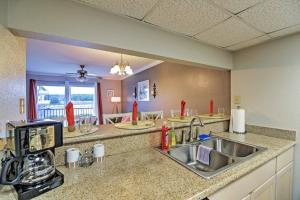 a kitchen with a sink and a counter top at Marina Townhouse at Oak Glenn in Ocean Springs