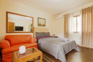 Postel nebo postele na pokoji v ubytování Foxy's Beach Resort + 37 fotografií