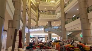 a shopping mall with a lot of people in it at EVO SOHO STUDIO Suites in Kampong Sungai Ramal Dalam