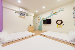 Giường trong phòng chung tại YOYO 11 House
