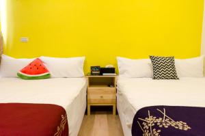 Giường trong phòng chung tại YOYO 11 House
