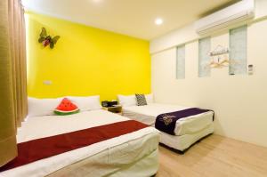 Giường trong phòng chung tại YOYO 11 House