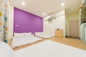 Giường trong phòng chung tại YOYO 11 House