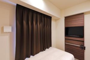 TV a/nebo společenská místnost v ubytování Welina Hotel Dotonbori