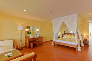 Postel nebo postele na pokoji v ubytování Dreamland Maldives Resort