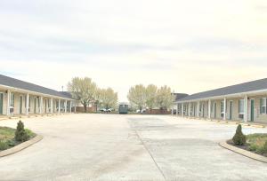 an empty parking lot in front of a building at Classic Suites - Cleveland in Cleveland