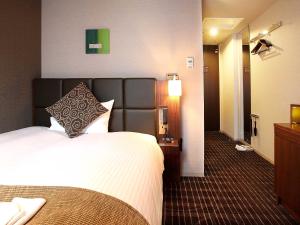 Cama o camas de una habitación en Hotel Gracery Tamachi