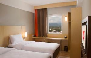 Letto o letti in una camera di Ibis Padang