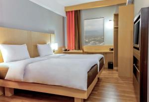 Letto o letti in una camera di Ibis Padang
