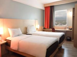 Letto o letti in una camera di Ibis Padang