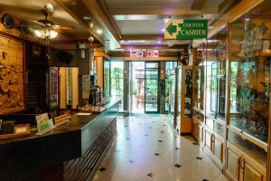 a store hallway with a counter in a store at โรงแรมศิริโฮเต็ล Sirihotel Korat in Nakhon Ratchasima