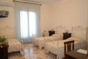 Posteľ alebo postele v izbe v ubytovaní Le Giare B&B