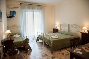 Posteľ alebo postele v izbe v ubytovaní Le Giare B&B