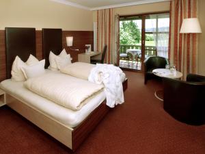 Ein Bett oder Betten in einem Zimmer der Unterkunft Xundheits Hotel Garni Eckershof