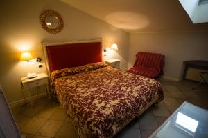 Postel nebo postele na pokoji v ubytování Alessi Hotel Trattoria