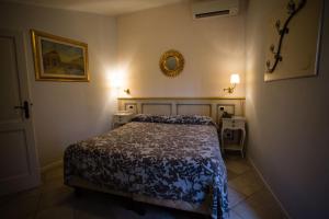 Postel nebo postele na pokoji v ubytování Alessi Hotel Trattoria