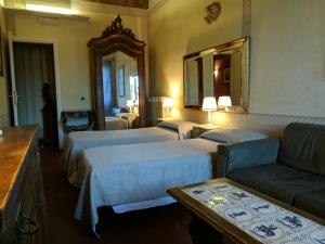 Кровать или кровати в номере Al Tuscany B&B