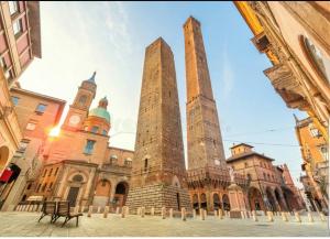 a building with two towers in the middle of a street at Ak Holidays Apartment 59 in Bologna