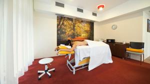 Postel nebo postele na pokoji v ubytování Spa & Wellness Hotel St. Moritz