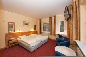 Postel nebo postele na pokoji v ubytování Hotel Belle Vue