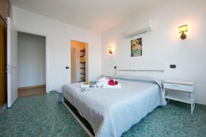 A bed or beds in a room at Lierna Fronte Lago