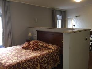 Postel nebo postele na pokoji v ubytování Alessi Hotel Trattoria