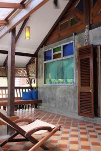 a room with a wooden floor and wooden walls at Panji Panji Tropical Wooden Home in Pantai Cenang