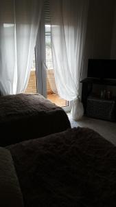 Łóżko lub łóżka w pokoju w obiekcie Villa los Angeles Piscine privée 16 pers