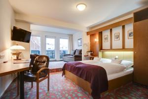 Postel nebo postele na pokoji v ubytování INA Hotel Consul