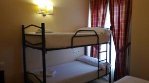Postel nebo postele na pokoji v ubytování Hotel Campos de Castilla